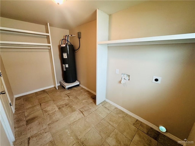 washroom featuring water heater, laundry area, baseboards, and hookup for an electric dryer