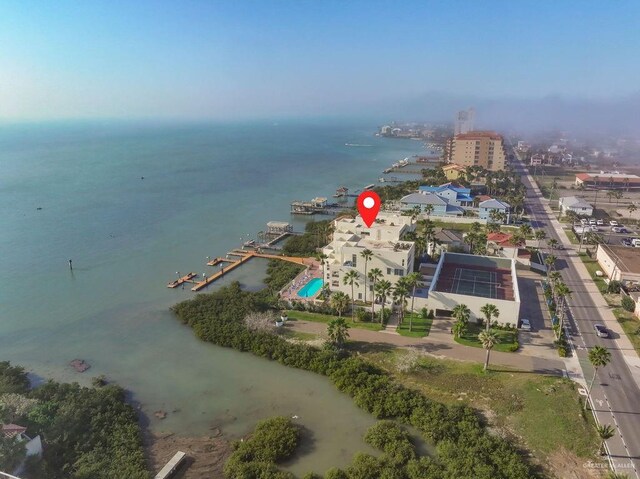 birds eye view of property with a water view