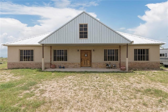 25662 N Fm 681, Edinburg, TX 78541 - view of front of house featuring stucco siding, a front yard, and stone siding