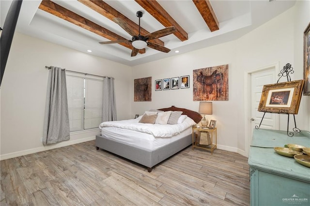 bedroom featuring beam ceiling, ceiling fan, and light hardwood / wood-style floors