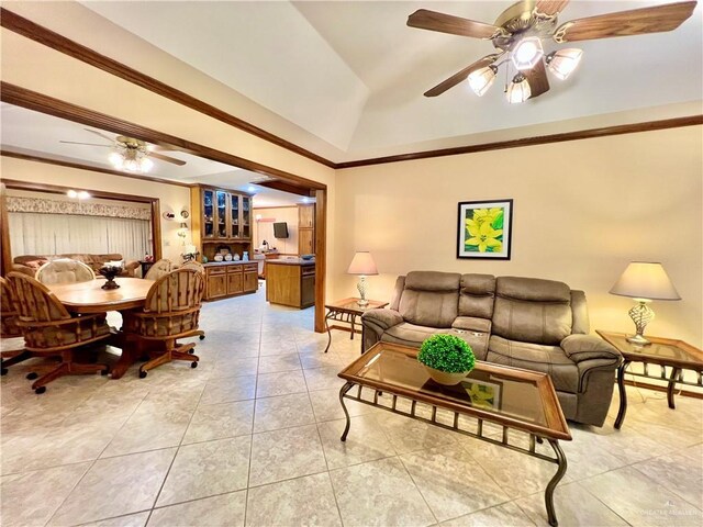 7226 Ford St, Mission, TX 78572 - living area featuring a ceiling fan, lofted ceiling, light tile patterned floors, and ornamental molding