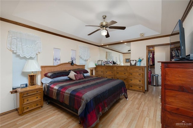 7226 Ford St, Mission, TX 78572 - bedroom with a raised ceiling, light wood-type flooring, crown molding, a walk in closet, and a closet
