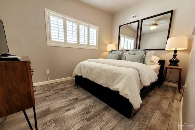 102 E Tarpon St, South Padre Island, TX 78597 - bedroom featuring wood finished floors and baseboards