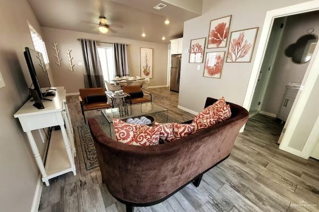 102 E Tarpon St, South Padre Island, TX 78597 - living room featuring wood finished floors and ceiling fan