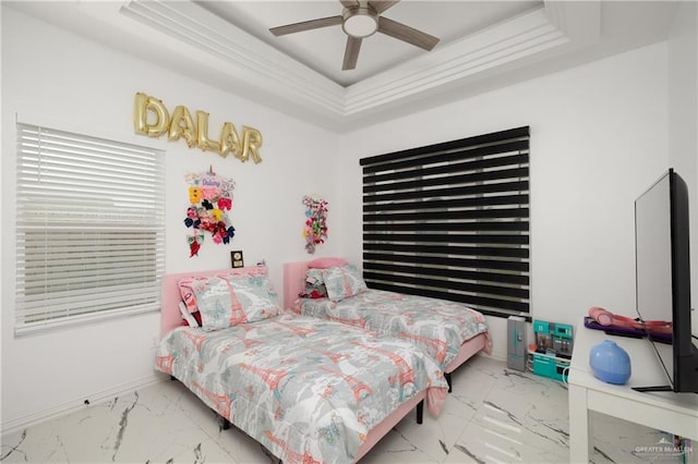 3100 Silver Oak Ave, Mission, TX 78574 - bedroom featuring marble look tiles, a raised ceiling, and a ceiling fan