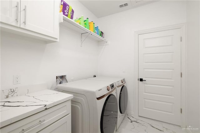 3100 Silver Oak Ave, Mission, TX 78574 - washroom with cabinet space, light marble finish floors, and washer and clothes dryer