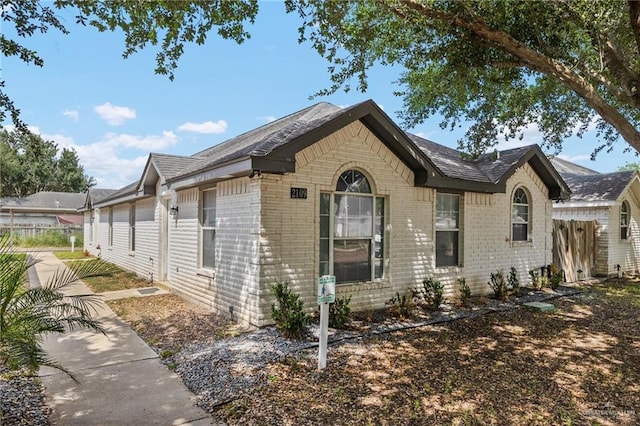 2109 Carlos Dr, Edinburg, TX 78541 - view of front of home with brick siding and roof with shingles