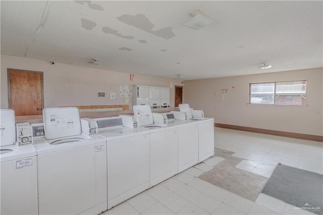 2095 La Palma Dr, San Benito, TX 78576 - community laundry with washer and clothes dryer, light floors, and baseboards