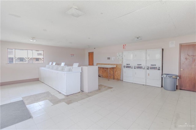 2095 La Palma Dr, San Benito, TX 78576 - living area featuring estacked washer and dryer, washer and dryer, and light floors