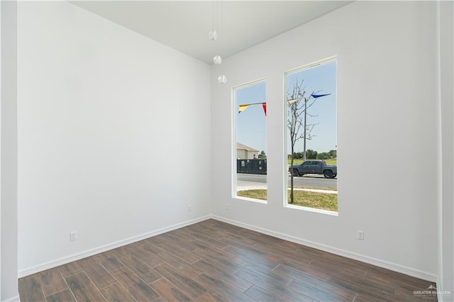 empty room featuring dark wood-type flooring