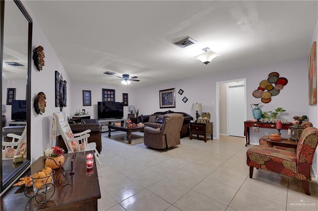 tiled living room with ceiling fan