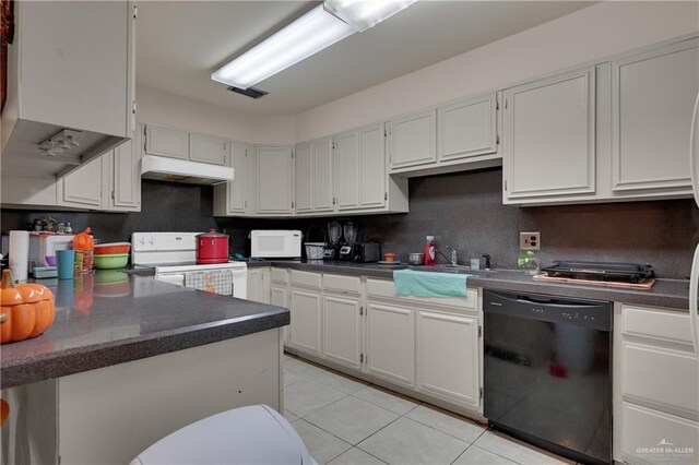 kitchen with kitchen peninsula, white cabinets, and white appliances