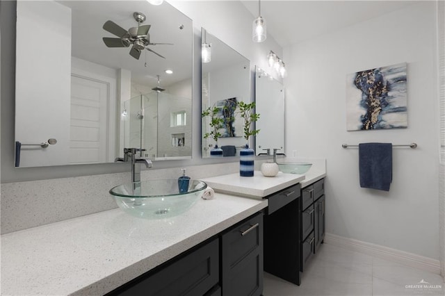 1213 N Garden Ridge Ave, San Juan, TX 78589 - bathroom featuring a stall shower, vanity, marble finish flooring, a ceiling fan, and baseboards