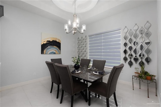 1213 N Garden Ridge Ave, San Juan, TX 78589 - dining space with a chandelier, baseboards, and light marble finish flooring