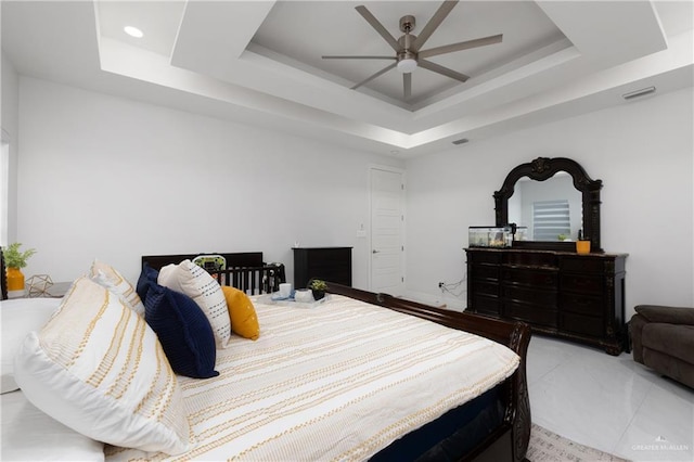 1213 N Garden Ridge Ave, San Juan, TX 78589 - bedroom with a raised ceiling and a ceiling fan