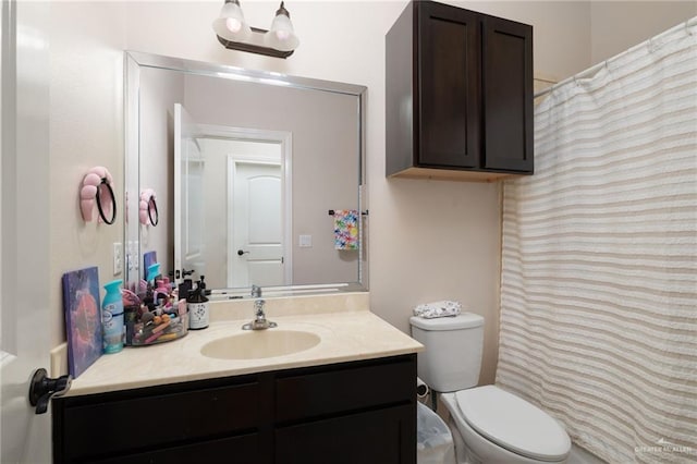 full bath featuring toilet and vanity