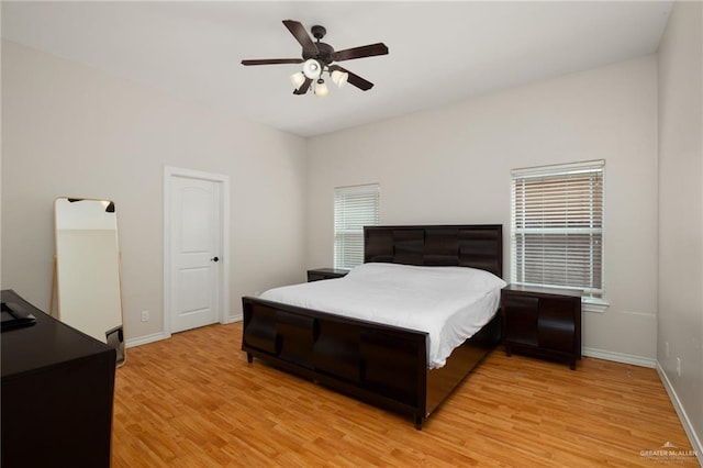 bedroom with baseboards, light wood-style flooring, and ceiling fan