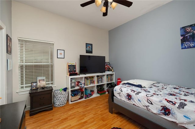 bedroom with ceiling fan and wood finished floors