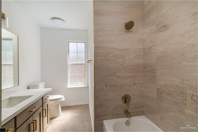 bathroom with vanity, tile patterned floors, toilet, and washtub / shower combination