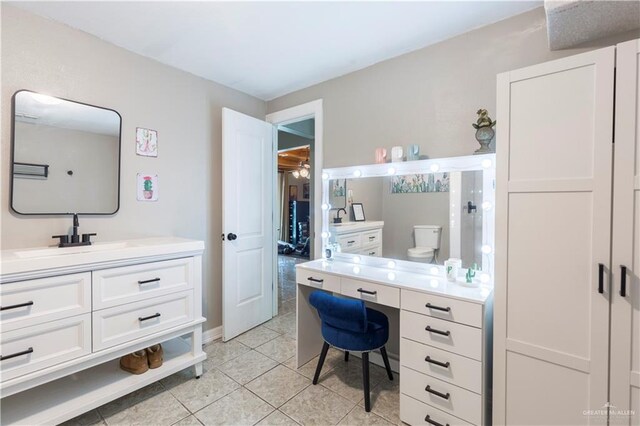 office area featuring sink and light tile patterned flooring