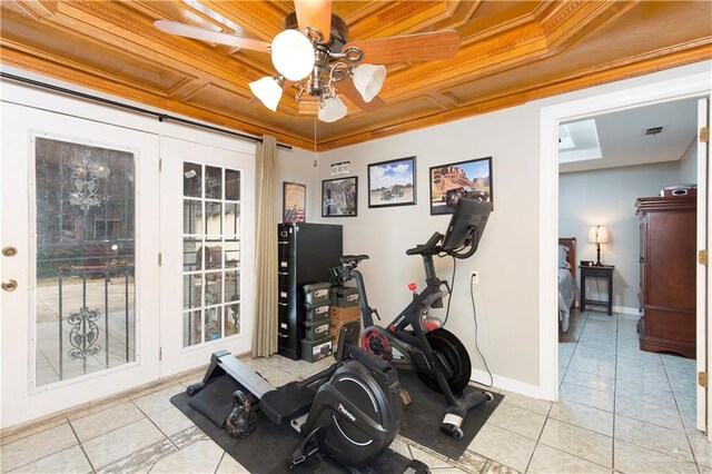 exercise room featuring ceiling fan, light tile patterned floors, wood ceiling, and ornamental molding