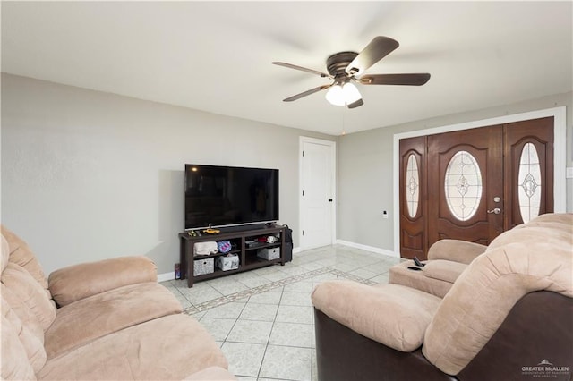 living room featuring ceiling fan and light tile patterned floors