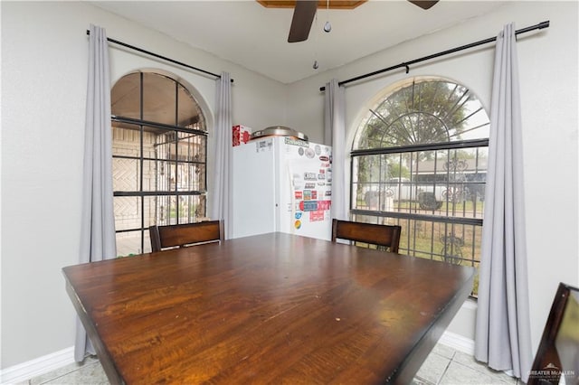 dining room featuring ceiling fan and light tile patterned flooring