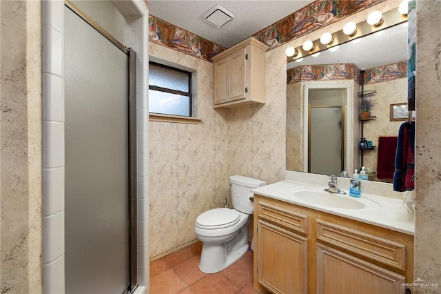 bathroom featuring tile patterned flooring, a textured ceiling, and a shower with door