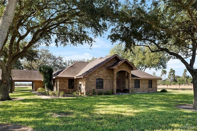 ranch-style home with a front lawn