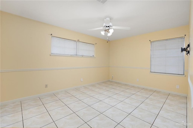 unfurnished room featuring ceiling fan and light tile patterned flooring