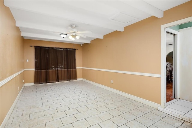 spare room featuring beamed ceiling, ceiling fan, and light tile patterned floors