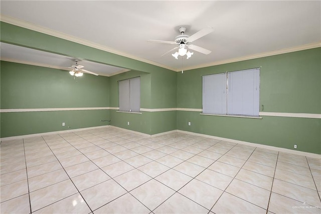 unfurnished room with ceiling fan, ornamental molding, and light tile patterned floors