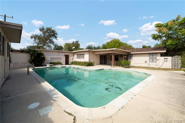 view of pool featuring a patio