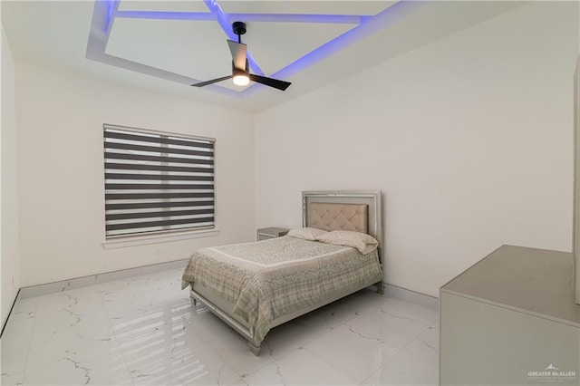 bedroom with marble finish floor, a ceiling fan, and baseboards