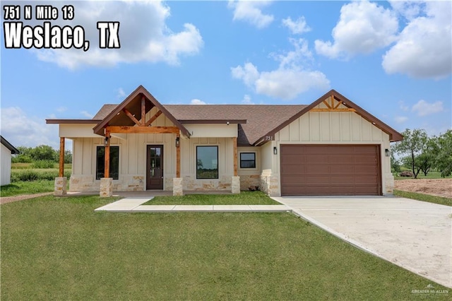 751 W Mile 13 N, Weslaco, TX 78599 - view of front facade with board and batten siding, a shingled roof, an attached garage, and a front yard