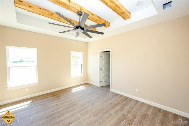 751 W Mile 13 N, Weslaco, TX 78599 - unfurnished room featuring beam ceiling, light wood-style floors, ceiling fan, and baseboards