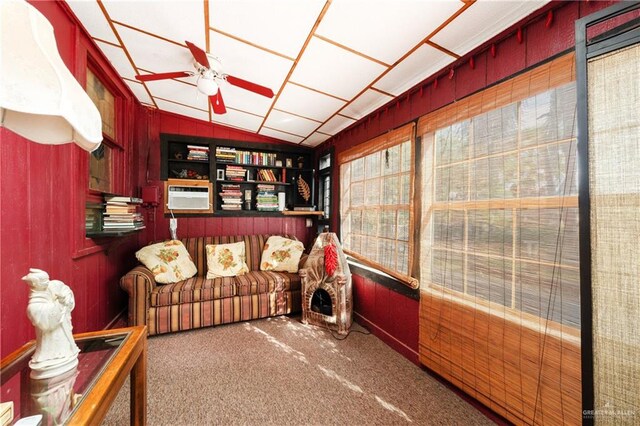 interior space featuring wood walls, a wealth of natural light, and vaulted ceiling