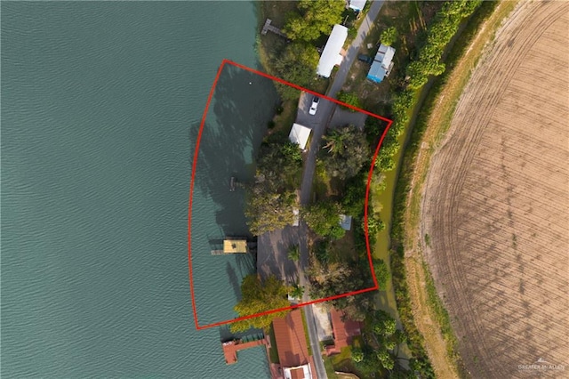 birds eye view of property featuring a water view