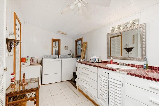 bathroom featuring lofted ceiling, tile patterned floors, sink, ceiling fan, and independent washer and dryer