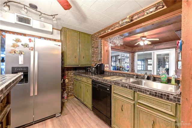 kitchen featuring stainless steel fridge with ice dispenser, black dishwasher, green cabinets, and sink