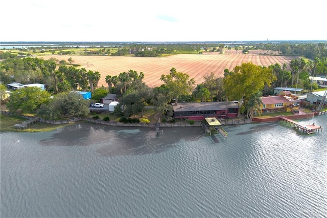 drone / aerial view featuring a water view and a rural view