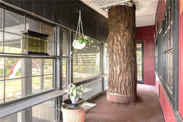 unfurnished sunroom featuring plenty of natural light