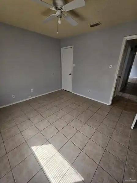 unfurnished room featuring ceiling fan