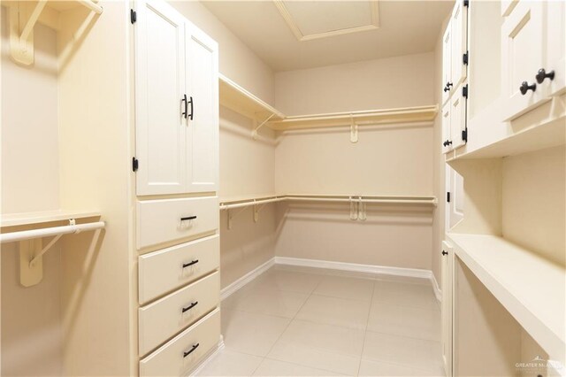 walk in closet featuring light tile patterned flooring