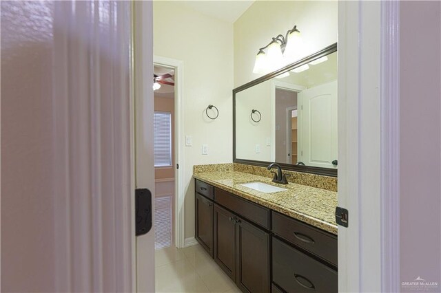 bathroom with tile patterned floors, ceiling fan, and vanity