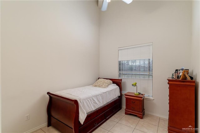 tiled bedroom with ceiling fan