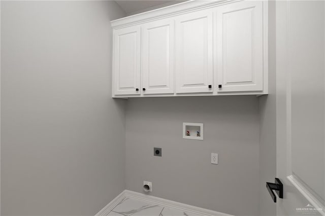 1606 Arden St, Mercedes, TX 78570 - washroom featuring electric dryer hookup, baseboards, cabinet space, washer hookup, and marble finish floors