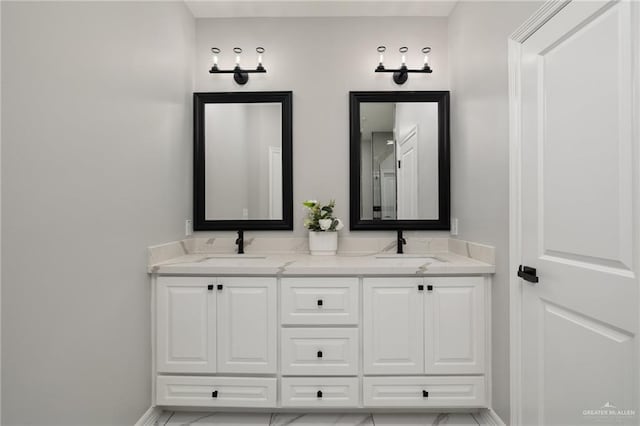 1606 Arden St, Mercedes, TX 78570 - bathroom featuring double vanity and baseboards