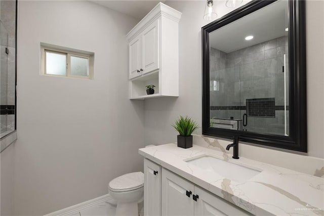 1606 Arden St, Mercedes, TX 78570 - full bath featuring toilet, vanity, a stall shower, marble look tiles, and baseboards