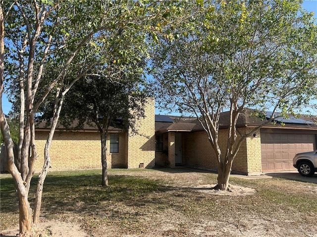 view of side of property with a garage